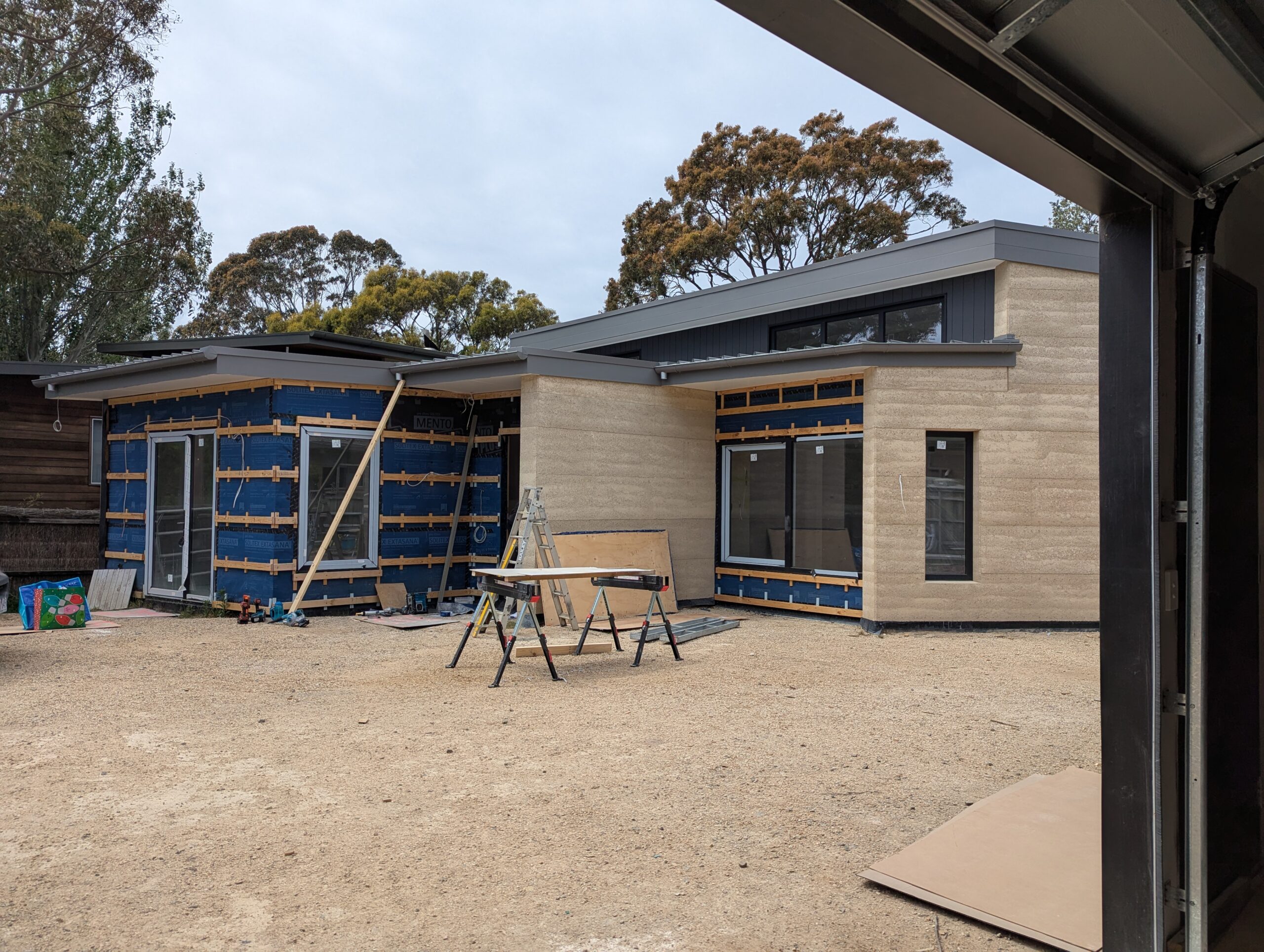 rammed earth home under construction